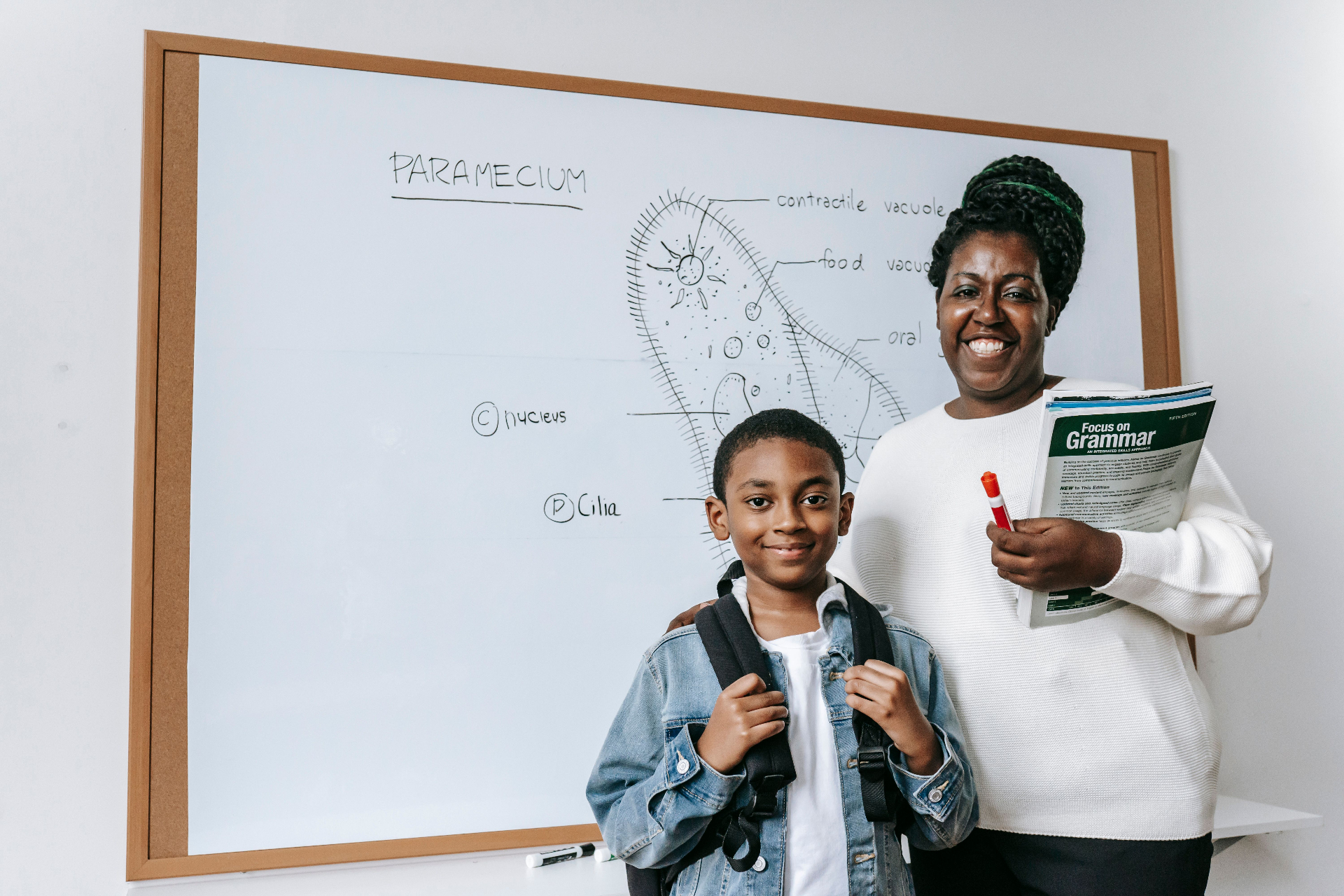Ebony with one of her students at the whiteboard